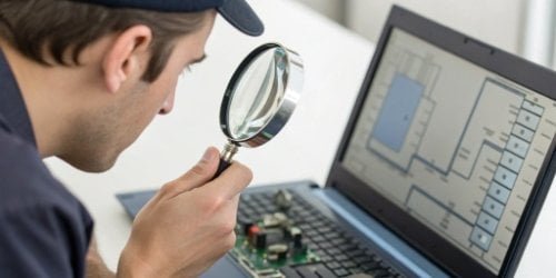 A person with a magnifying glass closely examining the connection between a scale and a software interface.
