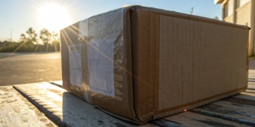 Faded Direct Thermal Label A faded and unreadable direct thermal shipping label on a box that has been in the sun