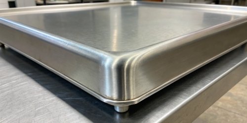 Close-up of a smooth, welded corner on a stainless steel scale with no crevices