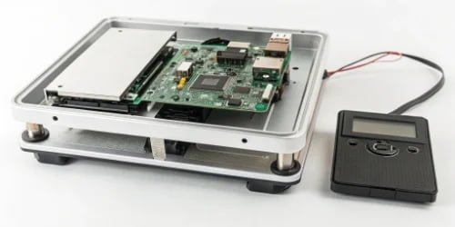 Smart PC Scale Internal Components Diagram showing the internal components of a smart PC scale: weighing sensor, motherboard, and printer module