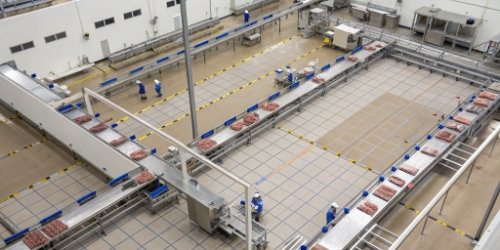 An overhead view of a well-organized meat processing plant layout showing a clear and efficient workflow.