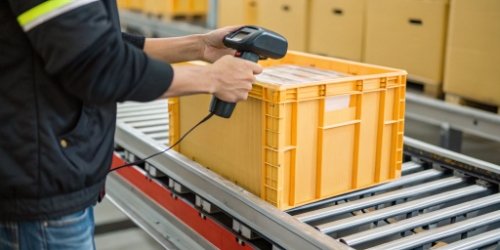 Scale with Barcode Scanner Close-up of a worker scanning a barcode on a crate that is on an industrial scale.