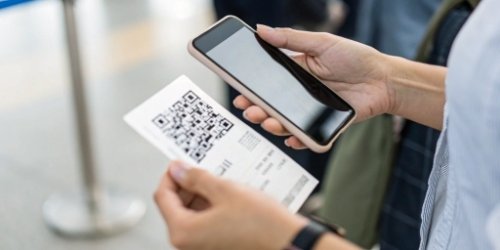 Close-up of a QR code on a weighing ticket being scanned by a smartphone