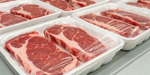Close-up of perfectly portioned meat packs ready for shipping