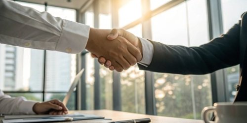 Reputation Built on Partnership A handshake sealing a deal, symbolizing trust and long-term partnership