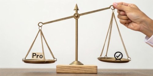 A simple diagram showing a balance scale with "Pros" on one side and "Cons" on the other. 