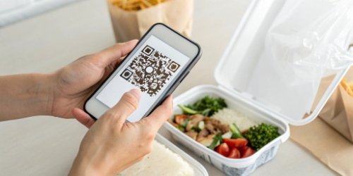 Food Traceability QR Code A QR code on a food package being scanned by a smartphone