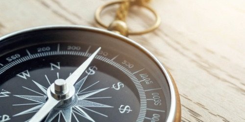 Pricing as a Financial Compass An image of a compass with the needle pointing towards a dollar sign, symbolizing financial direction